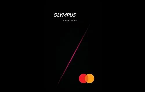 Axis Bank Olympus credit card next to a hotel key card and boarding pass