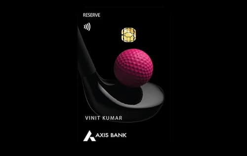 Axis Bank Reserve metal credit card on a marble surface with a golf glove