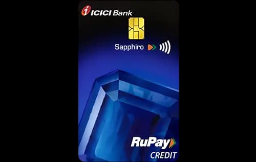 ICICI Sapphiro RuPay credit card next to a smartphone showing a UPI QR code